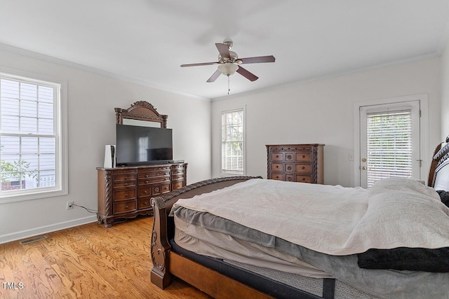 bedroom featuring ornamental molding, ceiling fan, and light hardwood / wood-style flooring