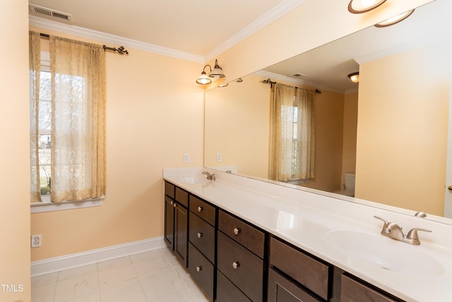 bathroom with crown molding, a wealth of natural light, and toilet