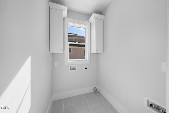 laundry room featuring cabinets, electric dryer hookup, and washer hookup