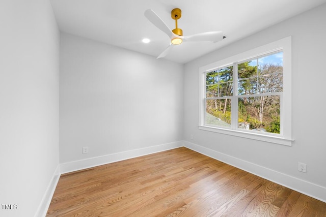 empty room featuring light hardwood / wood-style flooring and ceiling fan