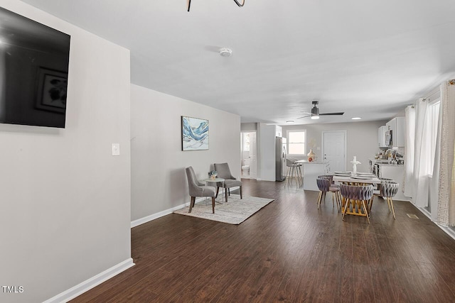 dining room featuring dark wood-type flooring and ceiling fan