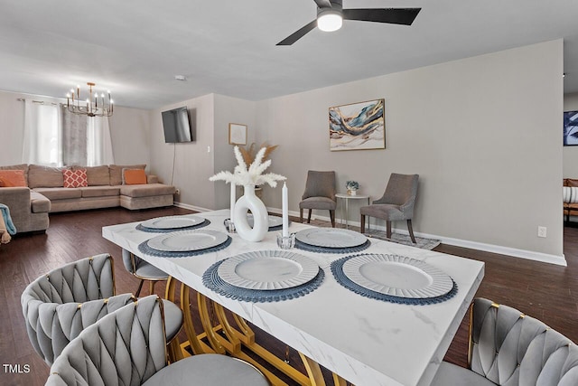 dining room featuring dark hardwood / wood-style floors and ceiling fan with notable chandelier