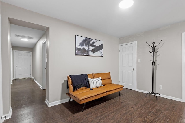 sitting room with dark hardwood / wood-style flooring