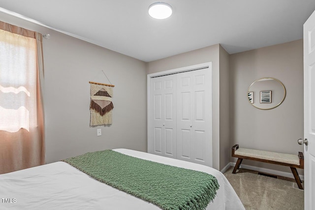 carpeted bedroom featuring a closet