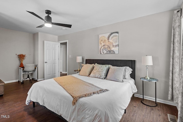 bedroom with ceiling fan and dark hardwood / wood-style flooring