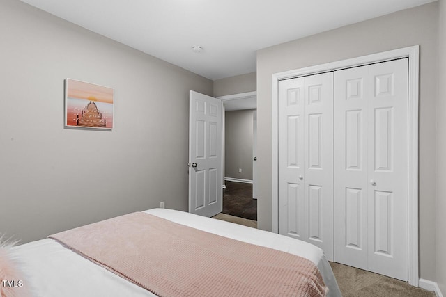 carpeted bedroom with a closet