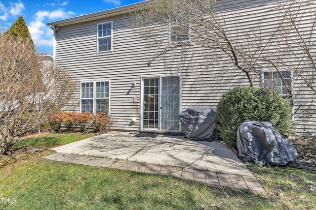 rear view of house featuring a patio