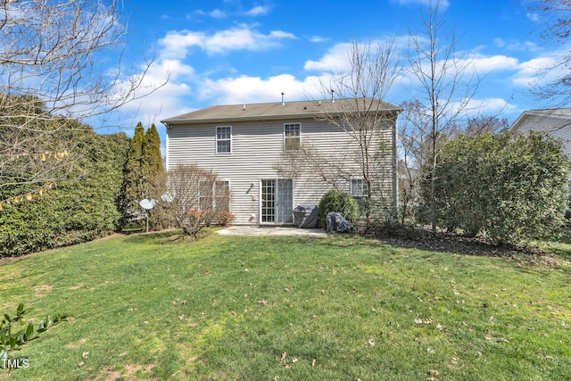 rear view of property featuring a patio area and a yard