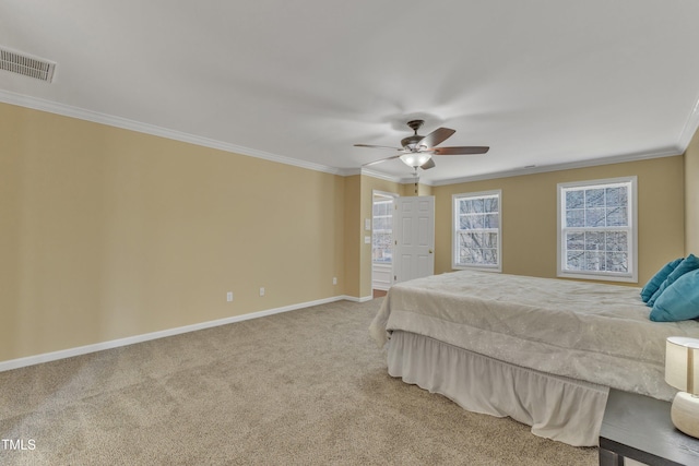 unfurnished bedroom featuring visible vents, crown molding, ceiling fan, baseboards, and carpet