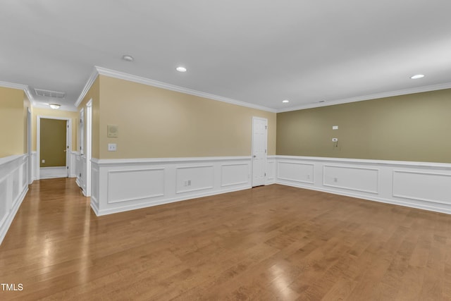 spare room with visible vents, recessed lighting, and wood finished floors