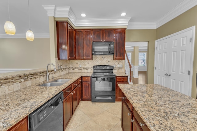 kitchen featuring a sink, backsplash, light stone countertops, black appliances, and reddish brown cabinets