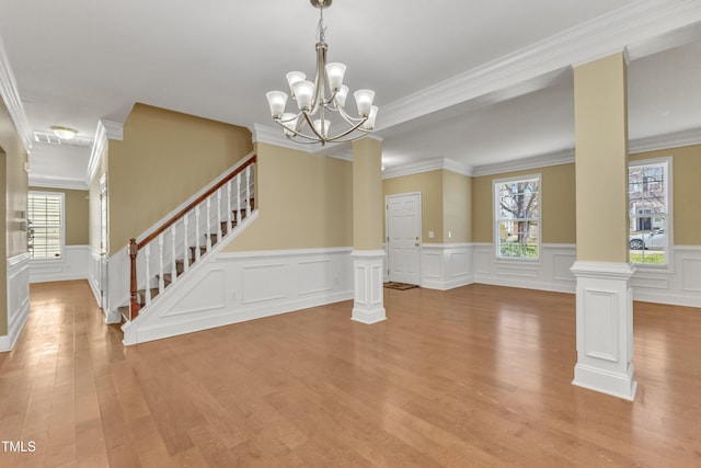 interior space with light wood finished floors, plenty of natural light, and stairs