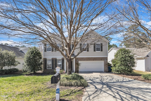 view of front of home featuring a front yard, an attached garage, brick siding, and driveway