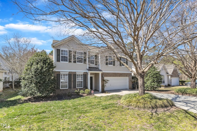 view of front of home featuring a front lawn, brick siding, an attached garage, and driveway