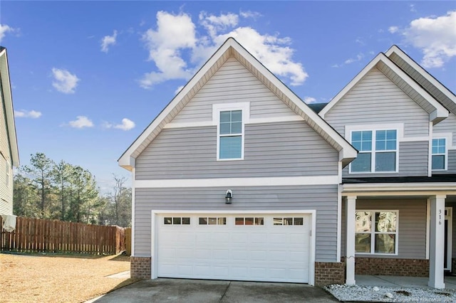 view of front of property with a garage and covered porch