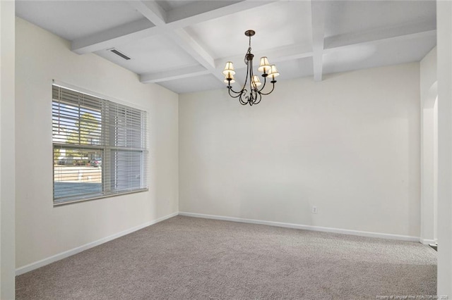 empty room featuring beam ceiling, coffered ceiling, carpet floors, and a chandelier