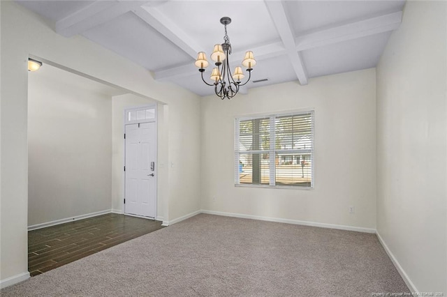 empty room with a notable chandelier, beam ceiling, and dark colored carpet