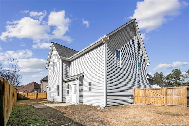 rear view of property with a patio area