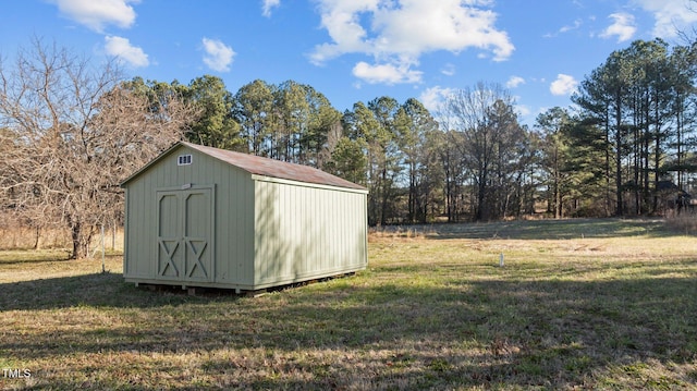 view of outdoor structure with a lawn