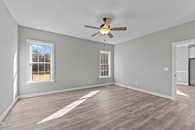 unfurnished room featuring ceiling fan and light hardwood / wood-style floors