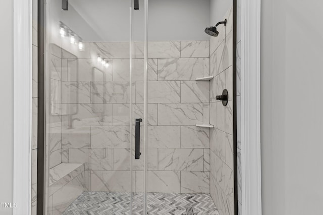 bathroom with a shower with shower door