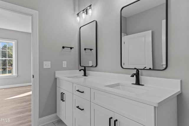 bathroom featuring vanity and hardwood / wood-style flooring