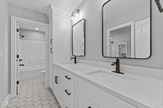 full bathroom featuring bathtub / shower combination, vanity, toilet, and tile patterned flooring