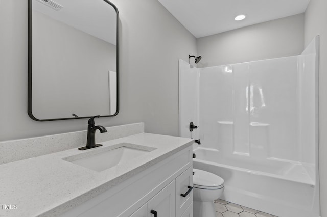 full bathroom featuring tile patterned floors, vanity, toilet, and tub / shower combination