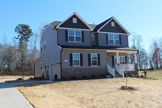 craftsman-style home with a garage and covered porch