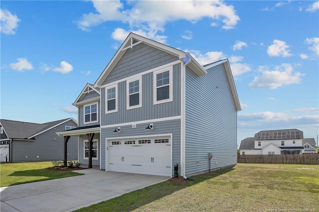 view of front of home featuring a garage and a front yard