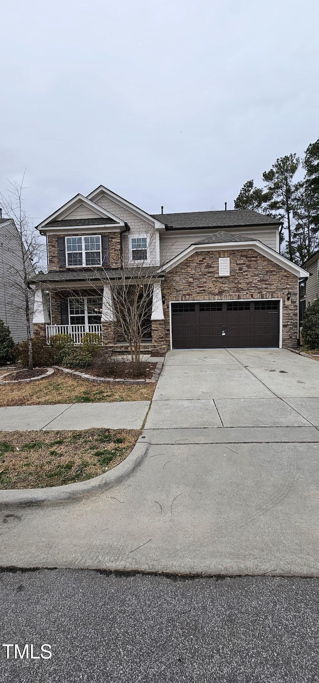 view of front of home with a garage and a porch