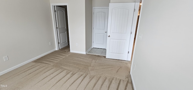 unfurnished bedroom with light carpet