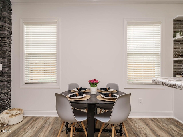 dining room with hardwood / wood-style flooring