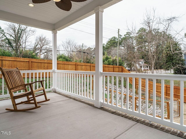 balcony with ceiling fan and a porch