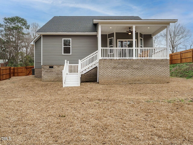 back of property with ceiling fan