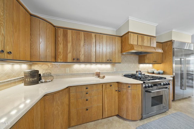 kitchen with high end appliances, tasteful backsplash, ornamental molding, and custom range hood