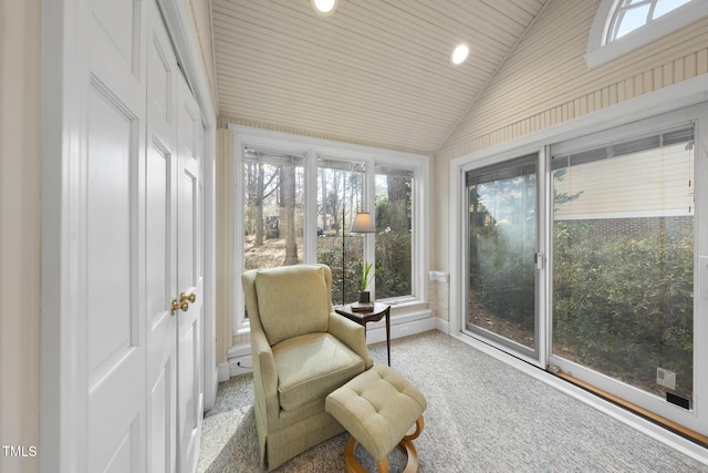 sunroom featuring vaulted ceiling