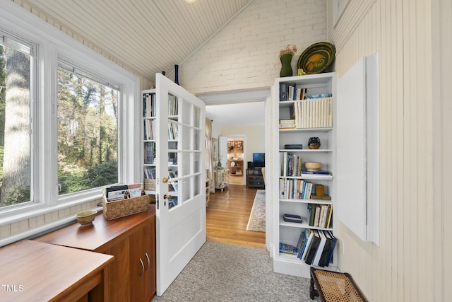 sunroom / solarium with lofted ceiling