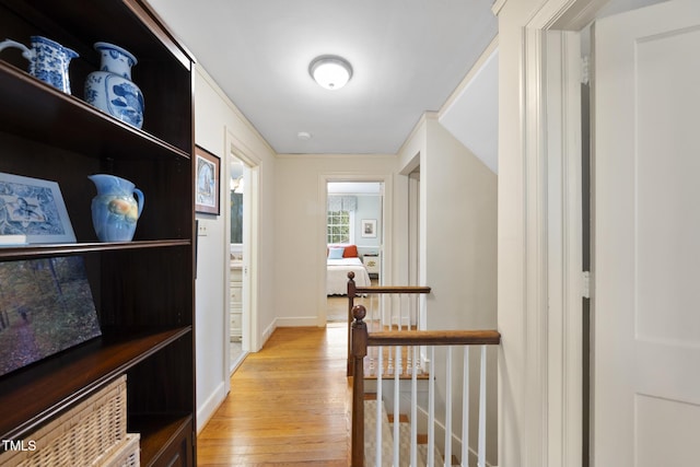 hall with light hardwood / wood-style flooring