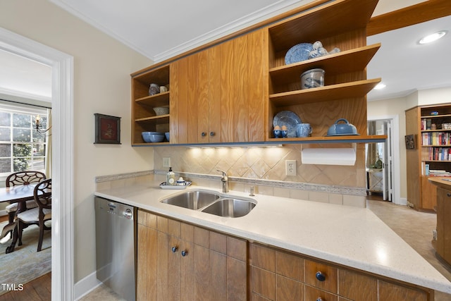 kitchen featuring sink, light stone counters, ornamental molding, decorative backsplash, and stainless steel dishwasher