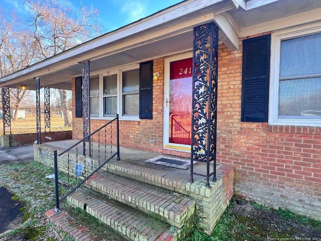 entrance to property with covered porch