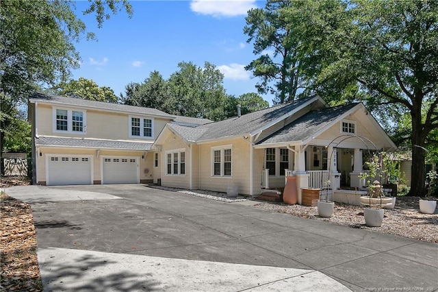 view of front of home featuring a garage and a porch