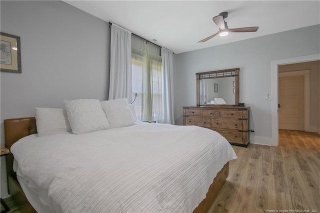 bedroom featuring light hardwood / wood-style flooring and ceiling fan