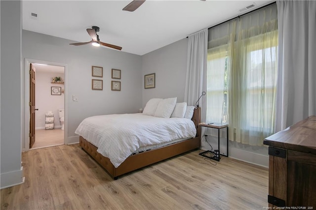 bedroom with ceiling fan and light hardwood / wood-style flooring