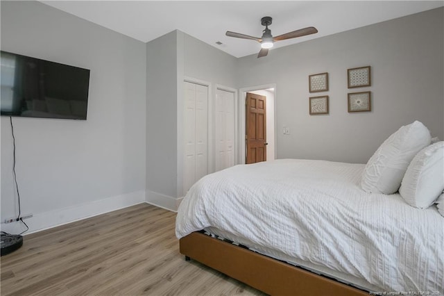 bedroom with a closet, ceiling fan, and light hardwood / wood-style flooring