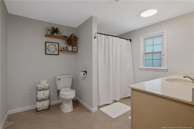 bathroom with vanity, walk in shower, tile patterned floors, and toilet