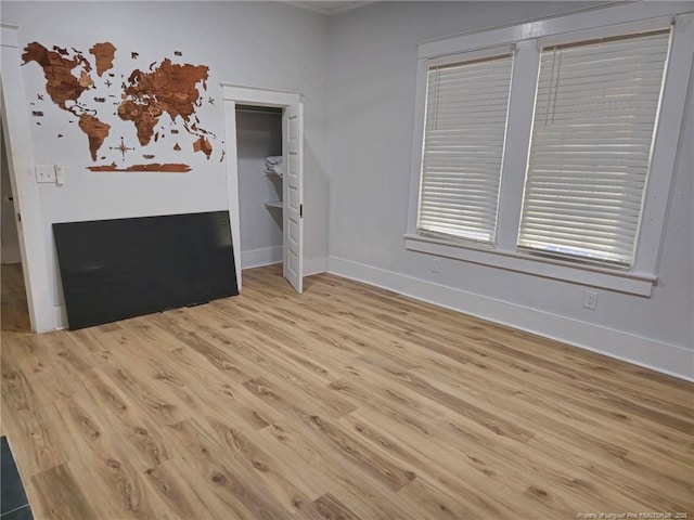 spare room with light hardwood / wood-style floors