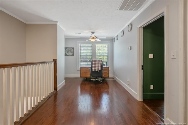 unfurnished office with dark wood-type flooring, ornamental molding, and ceiling fan