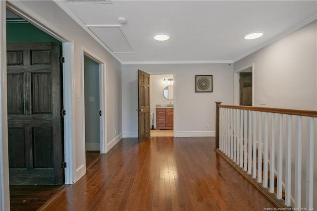 hallway with ornamental molding and dark wood-type flooring