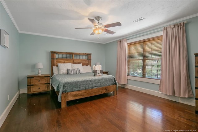 bedroom with crown molding, dark wood-type flooring, and ceiling fan